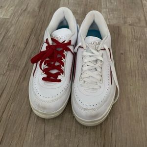 red, white, and blue nike airs.